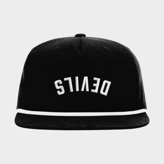 A black snapback cap with a white embroidered curved 'DEVIlS' logo on the front and a white rope along the brim, shown against a light gray background.